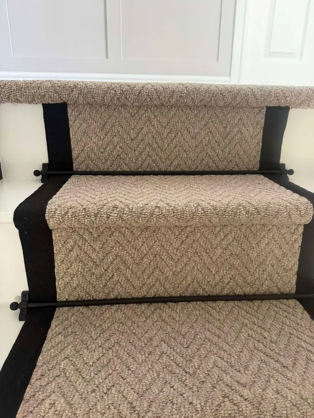 Herringbone runner with dark binding and stair rods