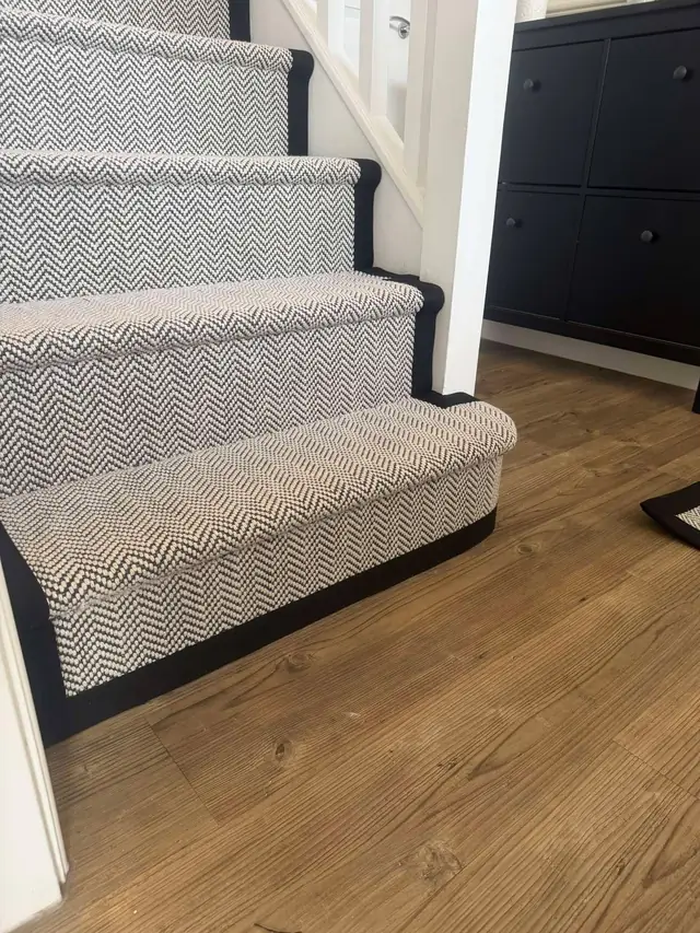 Grey runner fitted around the bottom step