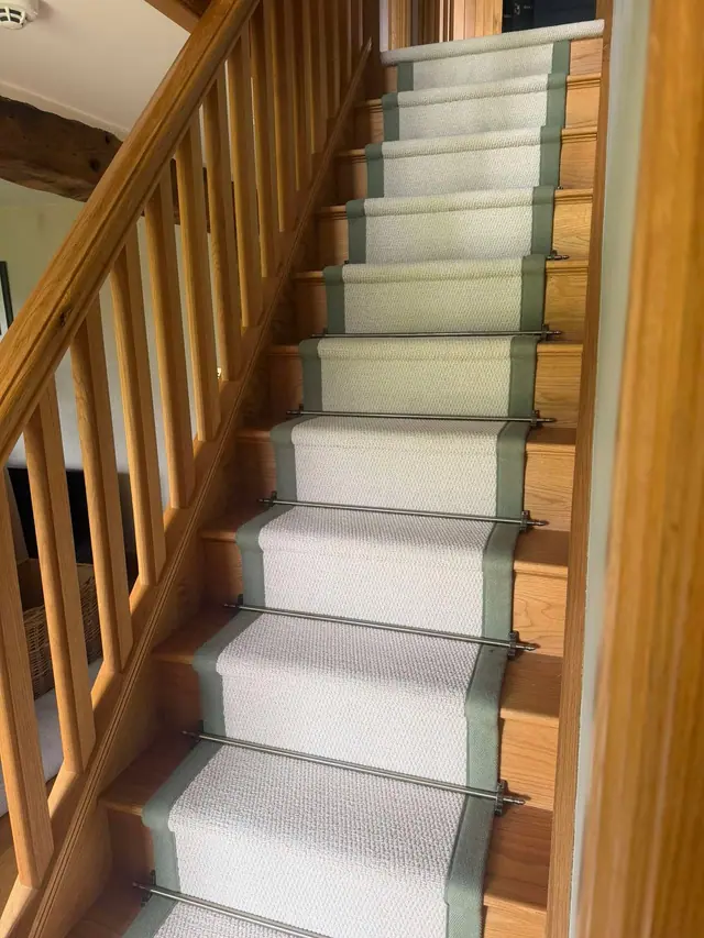 Cream runner beside a timber balustrade