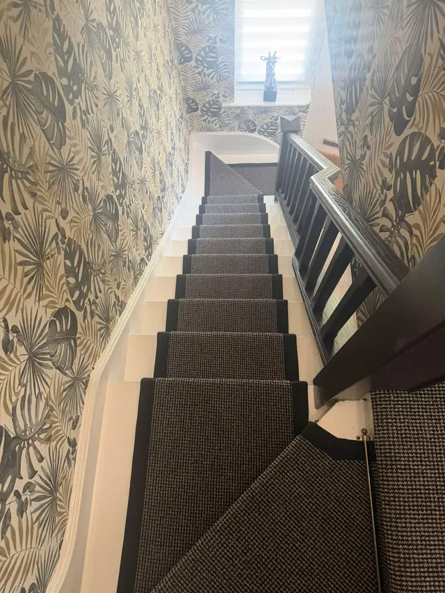 Dark runner on a narrow staircase
