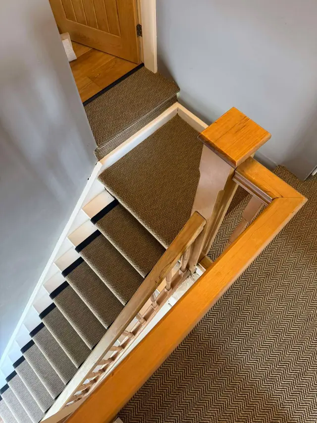 Bordered runner beside a timber handrail