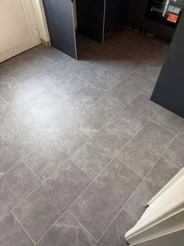 Stone-effect LVT through a kitchen doorway