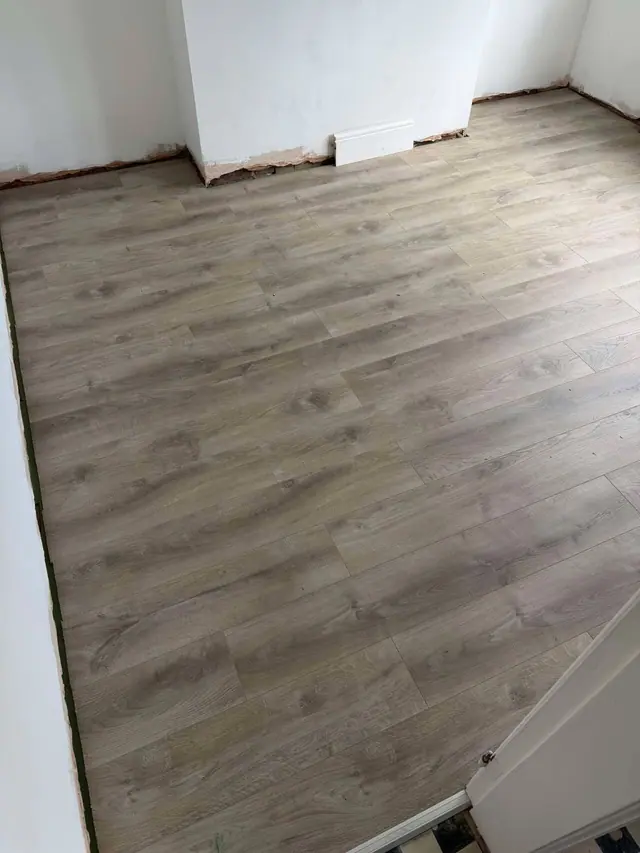 Grey laminate across a room being renovated