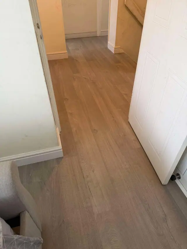 Warm wood-effect laminate through a doorway