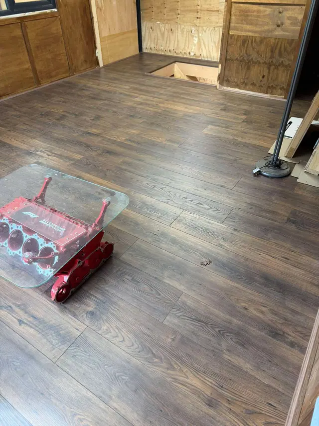 Dark rustic-effect laminate in a loft room