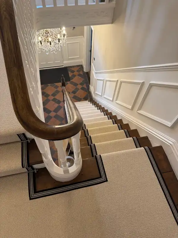 Dark bordered carpet stair runner