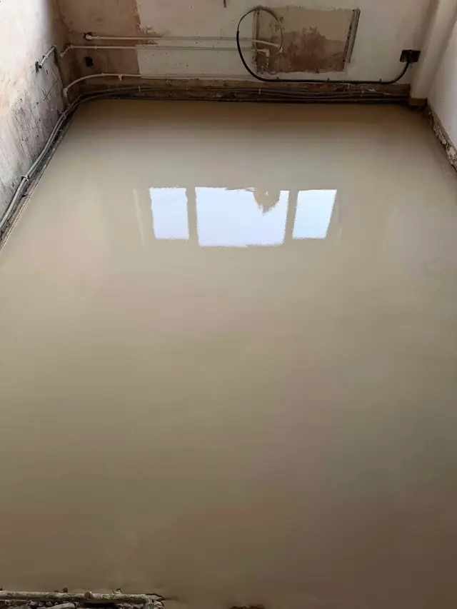 Kitchen subfloor after application of smoothing compound