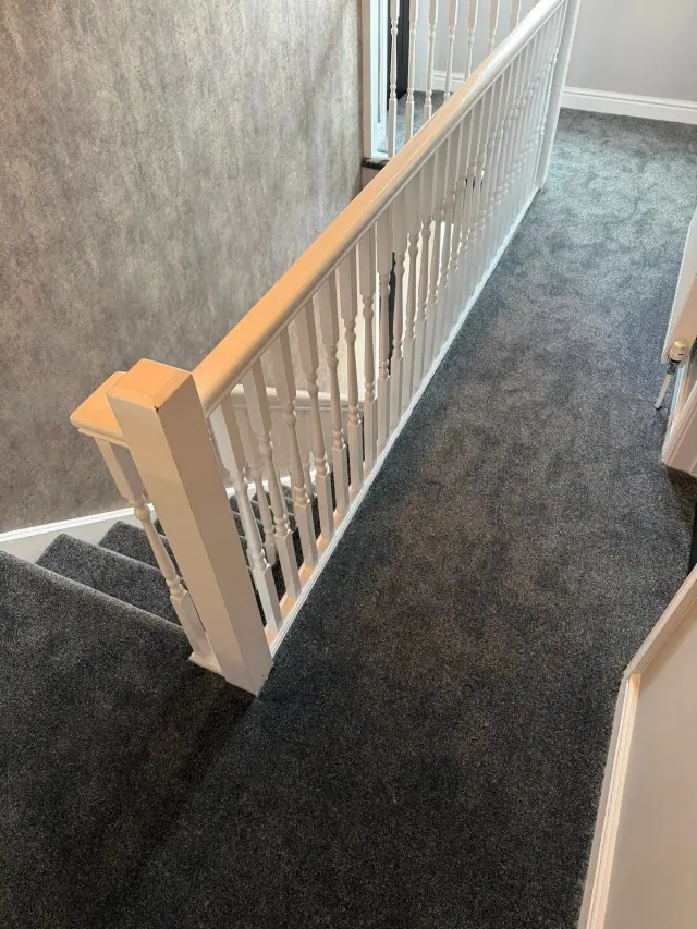 Grey carpet on stairs and landing