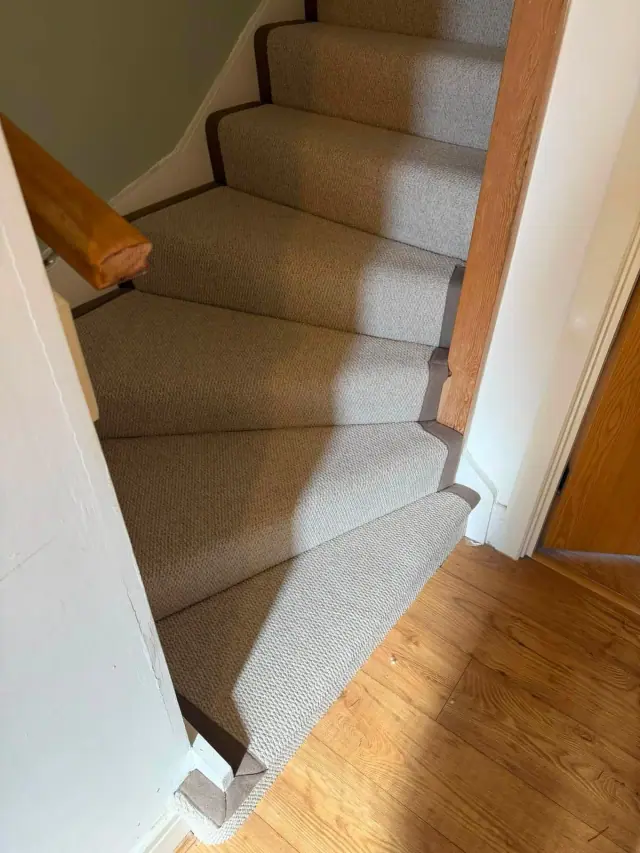 A woven stair runner with subtle binding