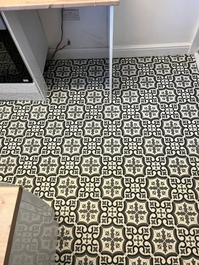 Decorative flooring beneath kitchen units